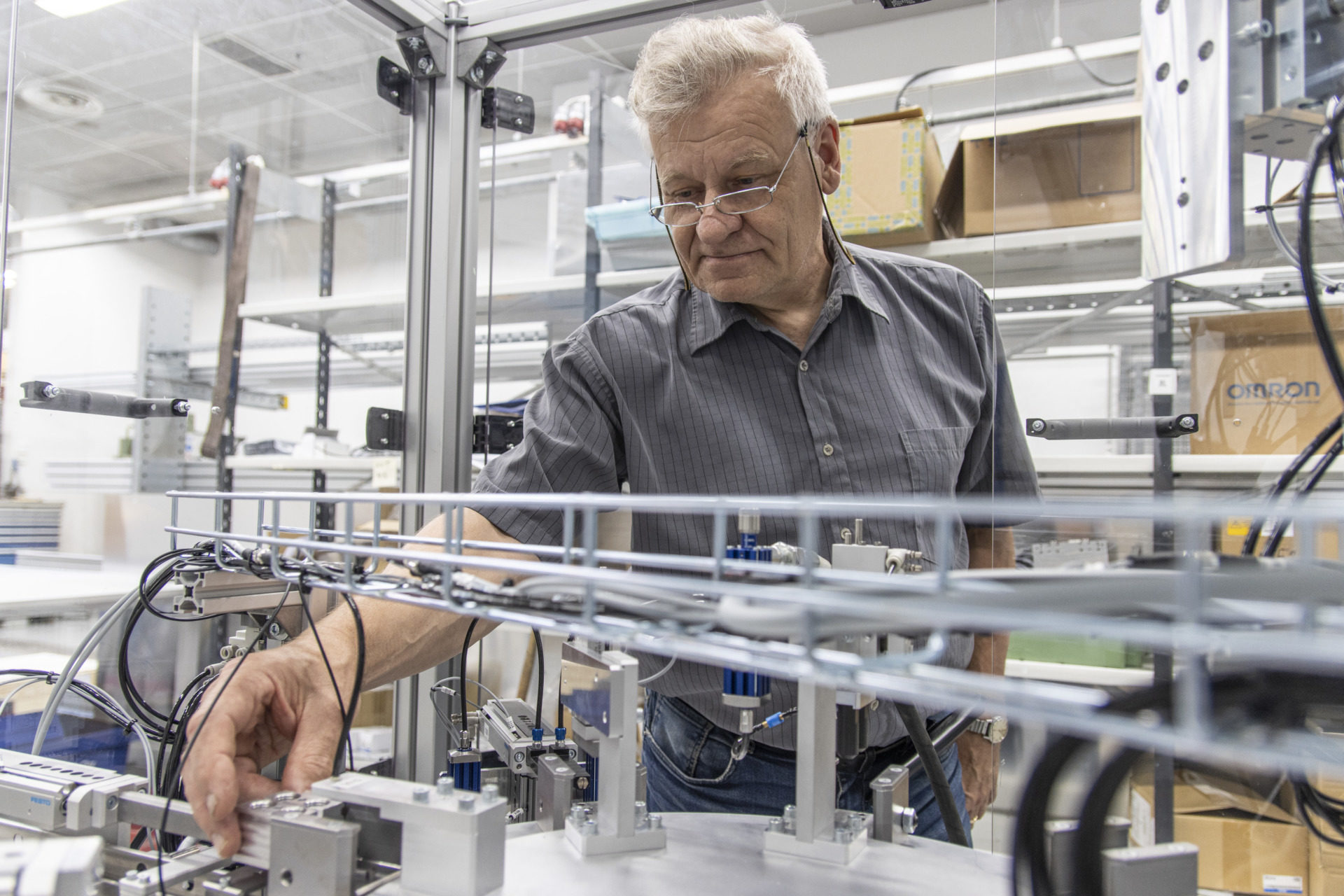 An older man takes a look at an automation unit