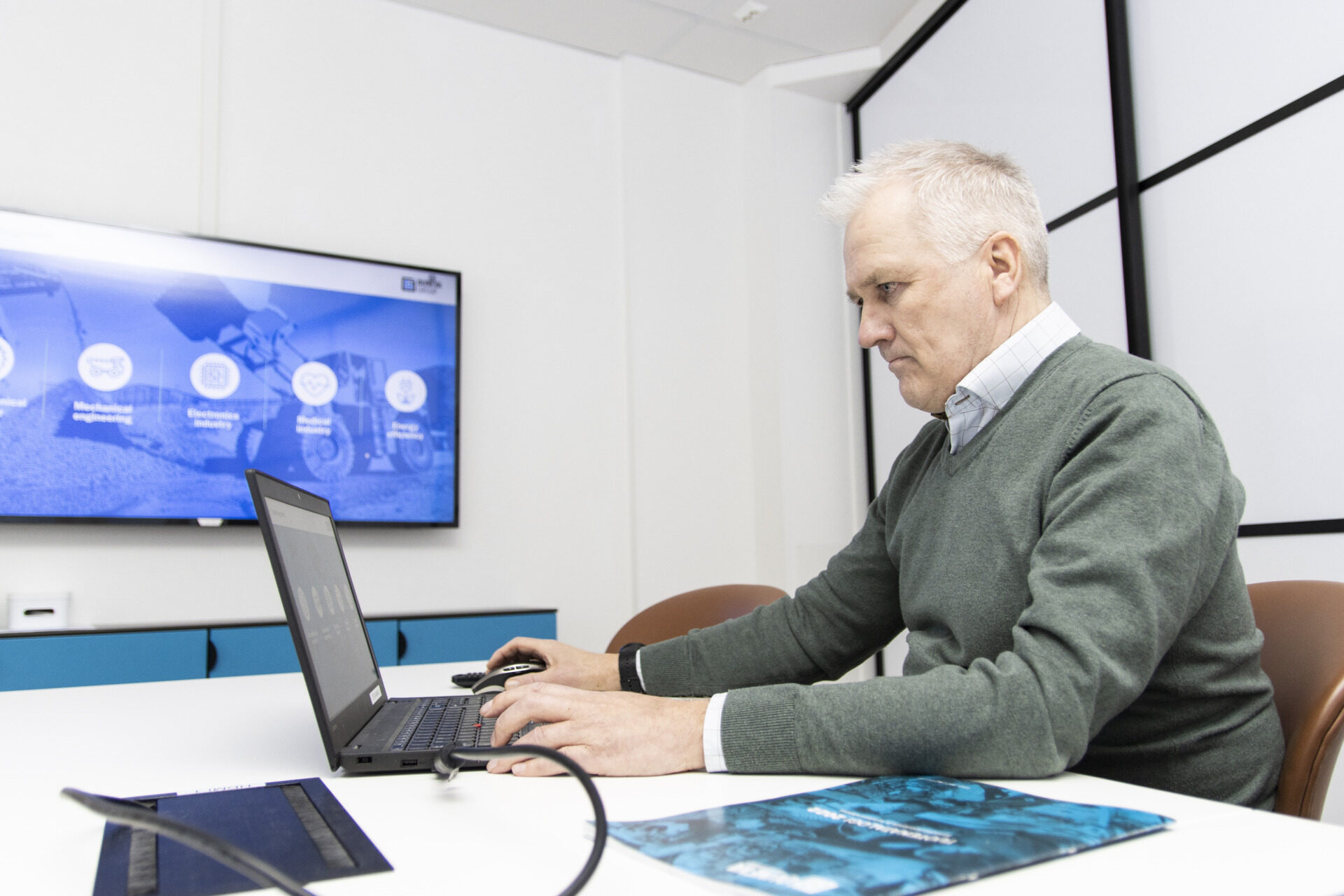 A man sitting in front of a computer