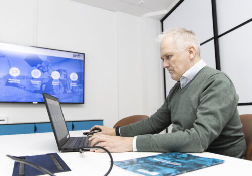 A man sitting in front of a computer