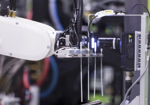 A medical device being inspected by machine vision