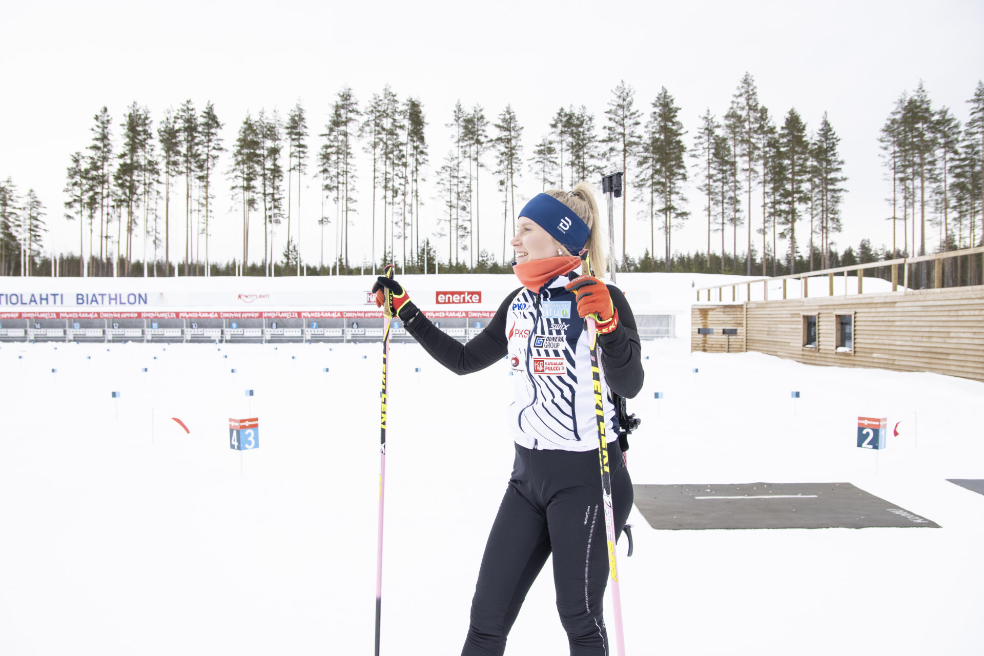 Biathlon athlete smiling at the sun